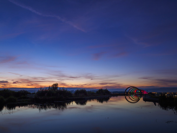 Falkirk Wheel at dusk. Picture Board by Tommy Dickson