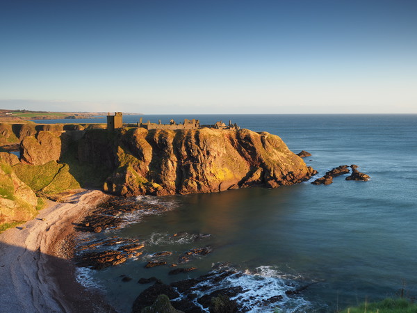 Sunrise over Dunnottar Castle Picture Board by Tommy Dickson