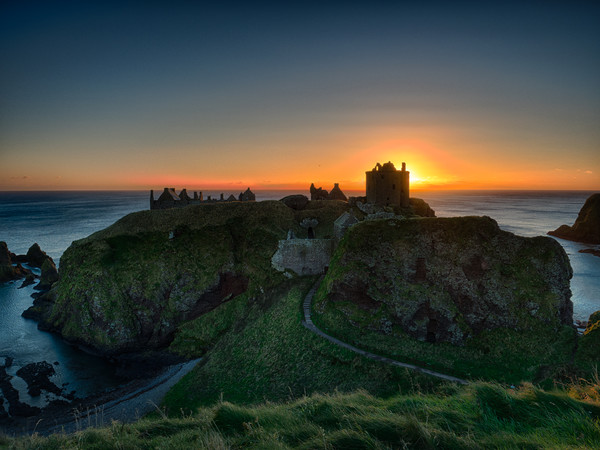 Dunnottar Castle at sunrise.                       Picture Board by Tommy Dickson