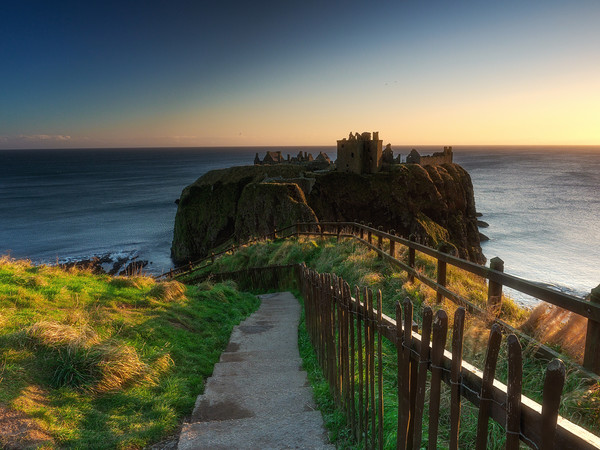 Sunrise at Dunnottar Castle. Picture Board by Tommy Dickson