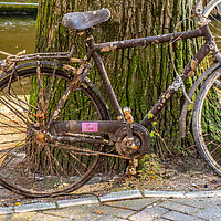 Buy canvas prints of Abandoned bike on an Amsterdam canal-side by Paul Nicholas