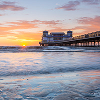 Buy canvas prints of Colourful sunset at The Grand Pier, Weston-Super-M by Daugirdas Racys