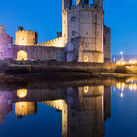Buy canvas prints of Caernarfon Castle at dusk by Daugirdas Racys