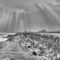 Buy canvas prints of Lindisfarne sun rays by Terry Dutchburn