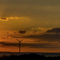 Buy canvas prints of Wind turbines against the sunset by Mark Bangert