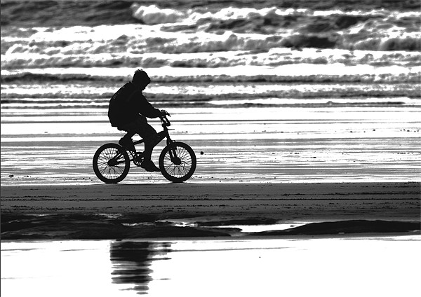 Lone Biker on Westward Ho! beach Picture Board by Mike Gorton