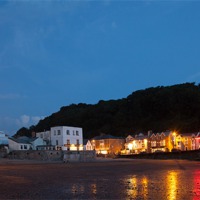 Buy canvas prints of Combe Martin Summer Night Reflections by Mike Gorton