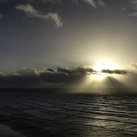 Buy canvas prints of Sun Rays over Saunton Sands by Mike Gorton