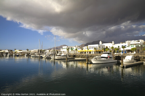 Storm clouds over Playa Blanca Marina Lanzarote Picture Board by Mike Gorton
