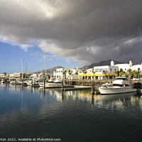Buy canvas prints of Storm clouds over Playa Blanca Marina Lanzarote by Mike Gorton
