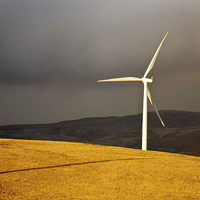 Buy canvas prints of  Wind Turbine standing tall in the evening sunligh by Spenser Davies