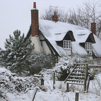 Buy canvas prints of The Cottage in the Snow by Ceri Jones