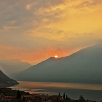 Buy canvas prints of  Sunrise over Lake Garda by Ceri Jones