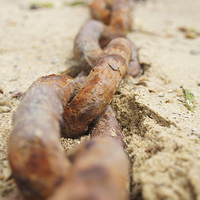 Buy canvas prints of Rusty ship chain in sand by Eric Fouwels