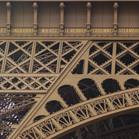 Buy canvas prints of Close-up of 7 names on the Eiffel Tower by Eric Fouwels