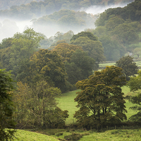 Buy canvas prints of Mist on the Fells by Julian Mitchell