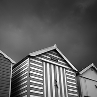 Buy canvas prints of Stormy Beach Huts by Julian Mitchell