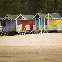 Buy canvas prints of Beach Huts at Wells-Nest-The-Sea by Julian Mitchell