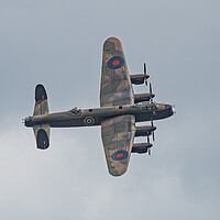 Buy canvas prints of Majestic Lancaster Bomber Over Clouds by Alan Tunnicliffe