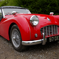 Buy canvas prints of Roaring red TR3 A timeless british classic by Alan Tunnicliffe