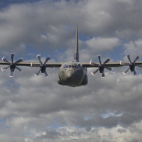 Buy canvas prints of Mighty hercules in flight by Alan Tunnicliffe
