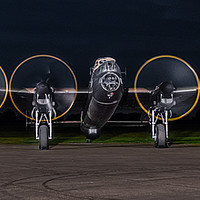 Buy canvas prints of Lancaster bomber Just jane at night by Alan Tunnicliffe