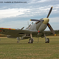Buy canvas prints of Majestic Spitfire on the Ground by Alan Tunnicliffe
