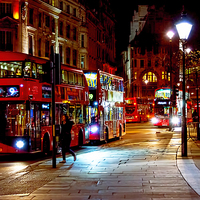Buy canvas prints of  London Busses at Trafalgar Square at night by Susan Sanger