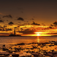 Buy canvas prints of Sunrise over the lighthouse by andrew stewart