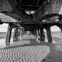 Buy canvas prints of  Under the pier by Ian Clamp