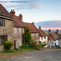 Buy canvas prints of Sunset over cottages on a cobbled street by Helen Hotson