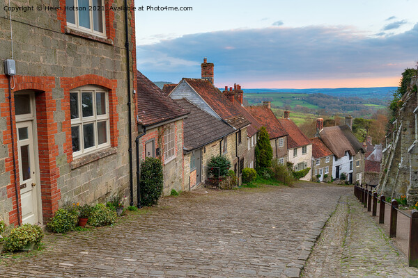 Pretty cottages on a cobbled street Picture Board by Helen Hotson