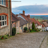 Buy canvas prints of Pretty cottages on a cobbled street by Helen Hotson