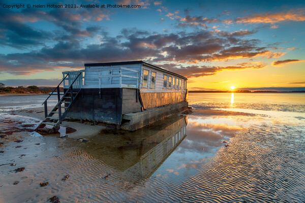 Stunning sunset over an old houseboat moored at Bramble Bush Bay Picture Board by Helen Hotson