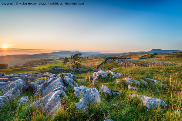 Sunset with clear blue skies over a limestone pavement at the Wi Picture Board by Helen Hotson