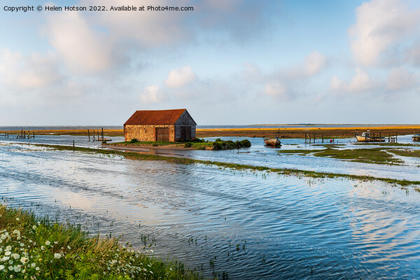 Spring tides flooding the old harbour at Thornham  Picture Board by Helen Hotson