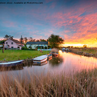 Buy canvas prints of Stunning sunset over the village green and boats on the river at by Helen Hotson