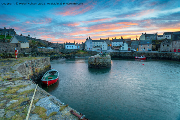 Sunset over Portsoy a fishing village in Aberdeenshire on the east coast of Scotland Picture Board by Helen Hotson