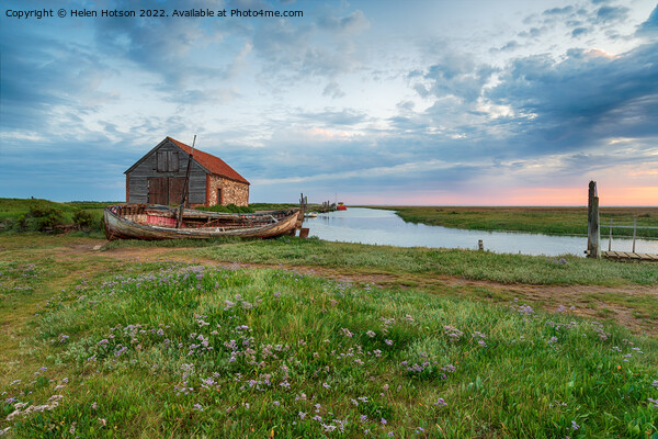 Dramatic sunrise sky over the old coal barn at Thornham Picture Board by Helen Hotson