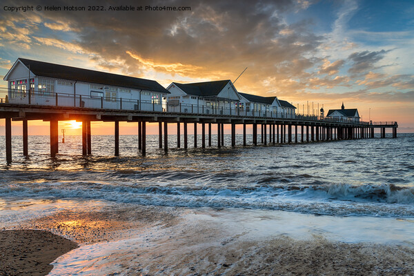 Sunrise over the pier at Southwold, Picture Board by Helen Hotson