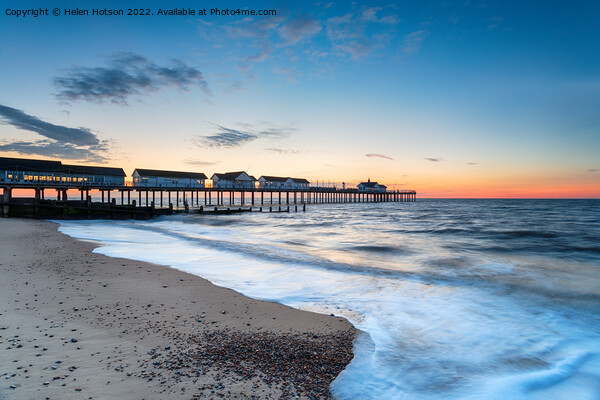 Dawn at the pier at Southwold  Picture Board by Helen Hotson