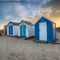 Buy canvas prints of Sunset over a row of pretty beach huts at Southwold  by Helen Hotson