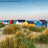 Buy canvas prints of Beach huts in the sand dunes at Southwold  by Helen Hotson