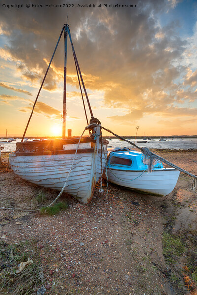 Stunning sunset over old fishing boats on the shore at West Mers Picture Board by Helen Hotson