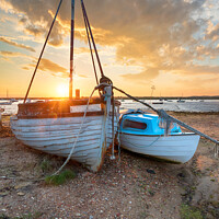Buy canvas prints of Stunning sunset over old fishing boats on the shore at West Mers by Helen Hotson
