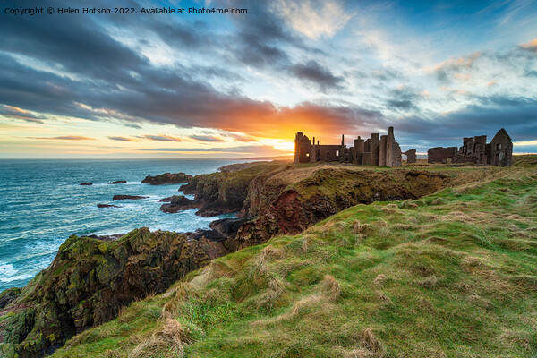 Dramatic sunset over the ruins Slains Castle Picture Board by Helen Hotson