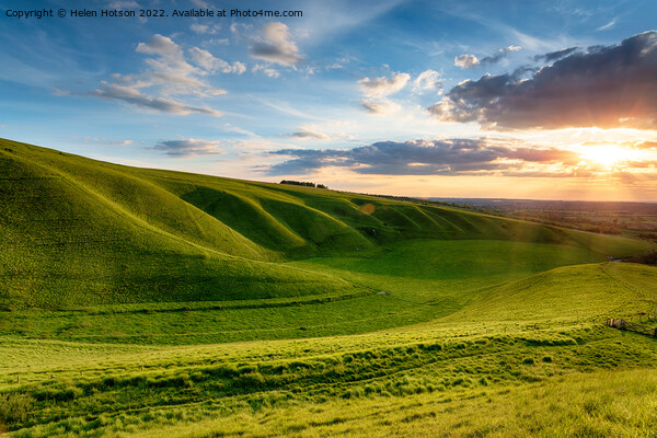 Dramatic sunset over The Manger at Uffington in Oxforshire, Picture Board by Helen Hotson