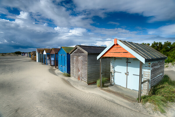 Beach Huts on a Sandy Beach Picture Board by Helen Hotson