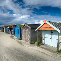 Buy canvas prints of Beach Huts on a Sandy Beach by Helen Hotson