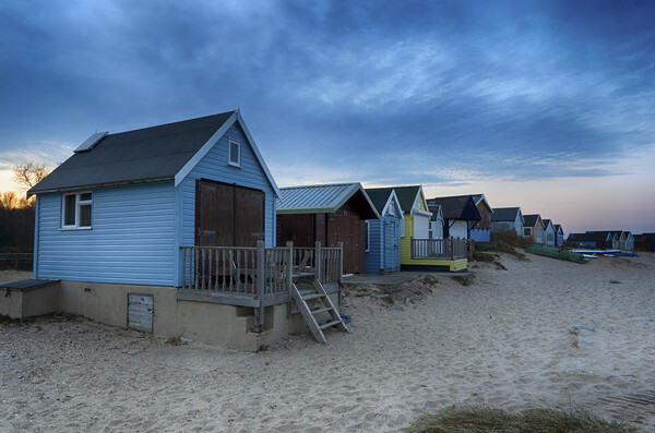 Beach Huts at Dusk Picture Board by Helen Hotson